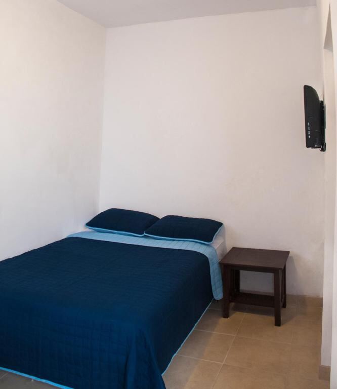 Studio for two adults with queen bed at Hotel Bugambilias
